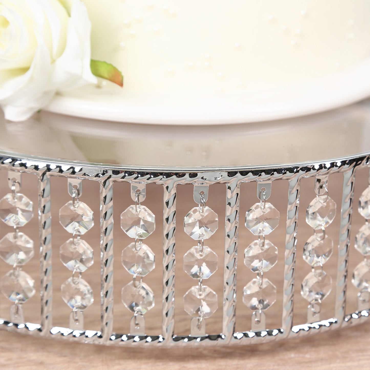 Silver cake stand with hanging crystal beads and glass top.