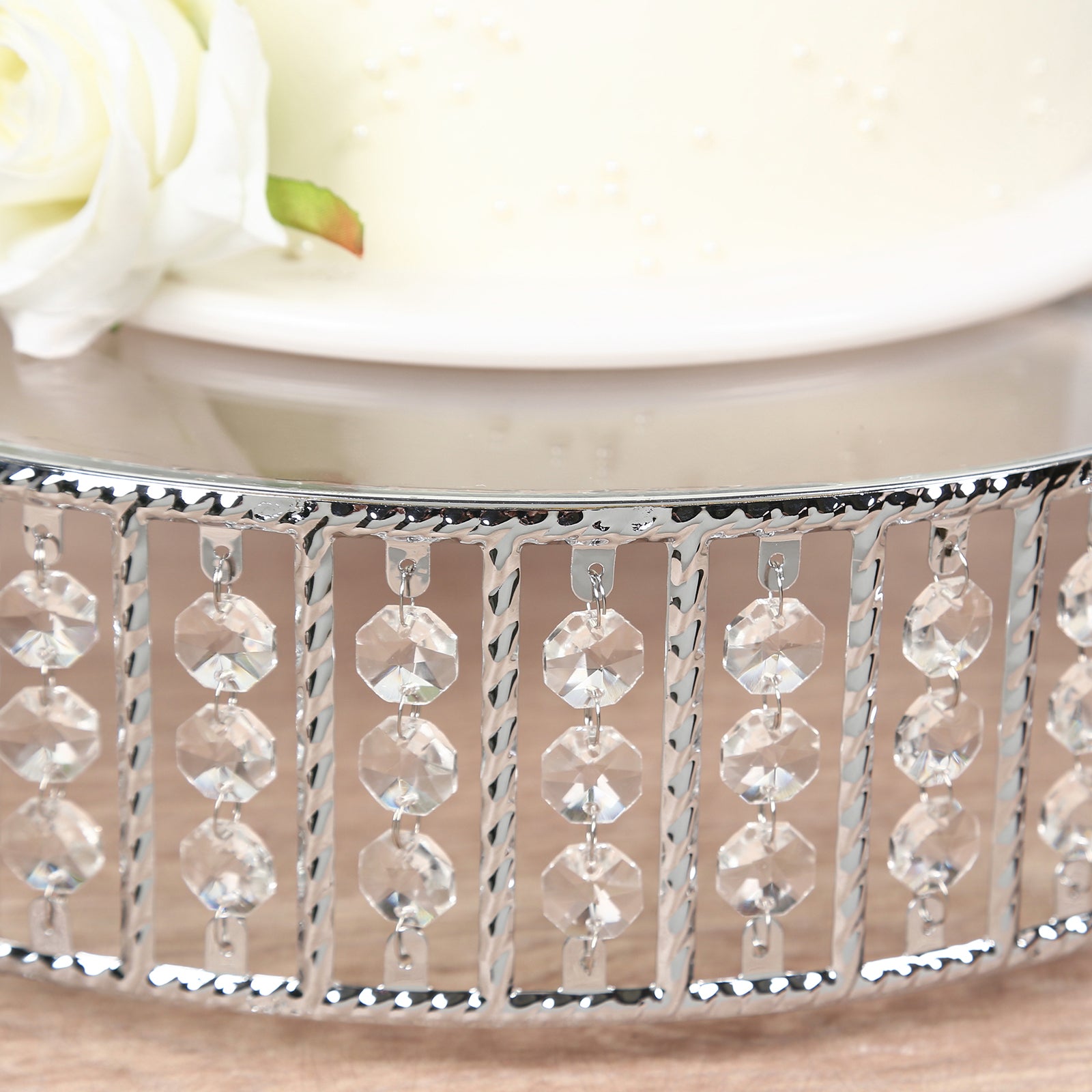 Silver cake stand with hanging crystal beads and glass top.