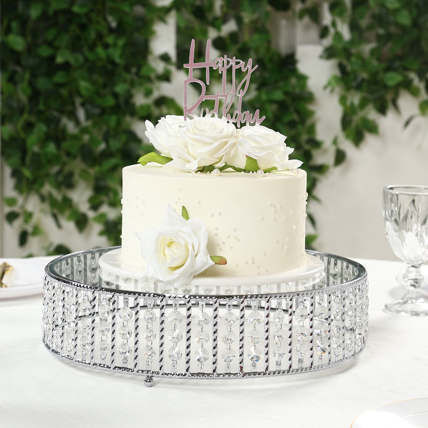 14" round silver cake stand with hanging crystal beads and glass top.