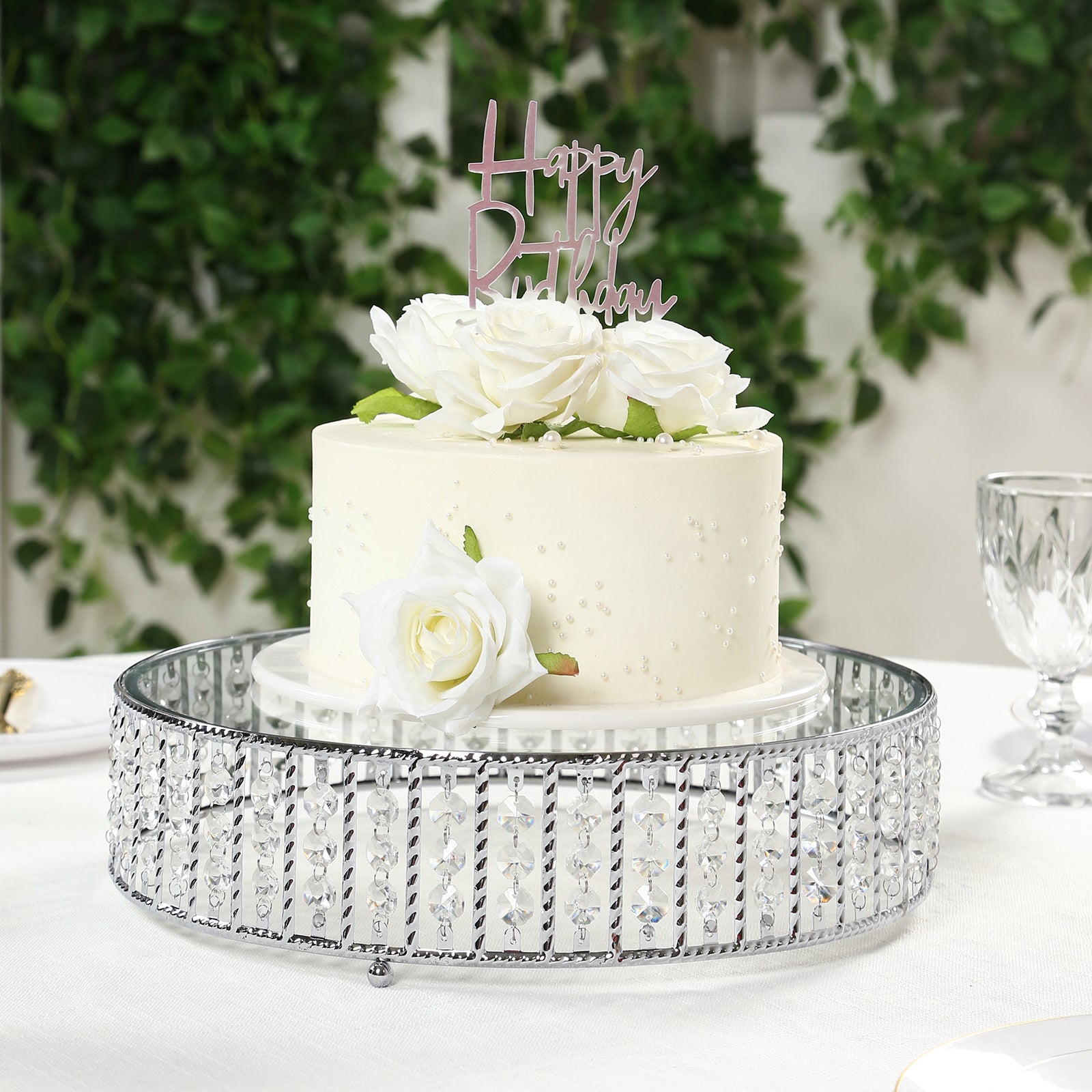 14" round silver cake stand with hanging crystal beads and glass top.