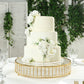 Gold round cake stand with hanging crystal beads and glass top.