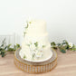 Gold round cake stand with crystal beads and glass top, perfect for desserts.
