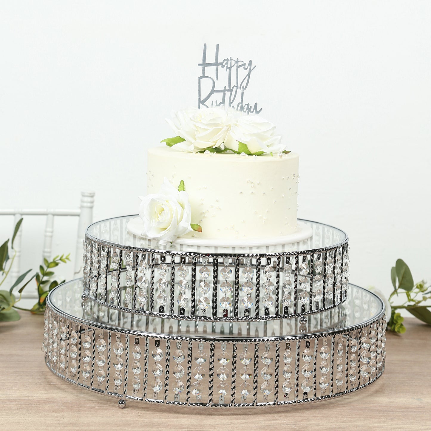 18" round silver cake stand with hanging crystal beads and glass top.
