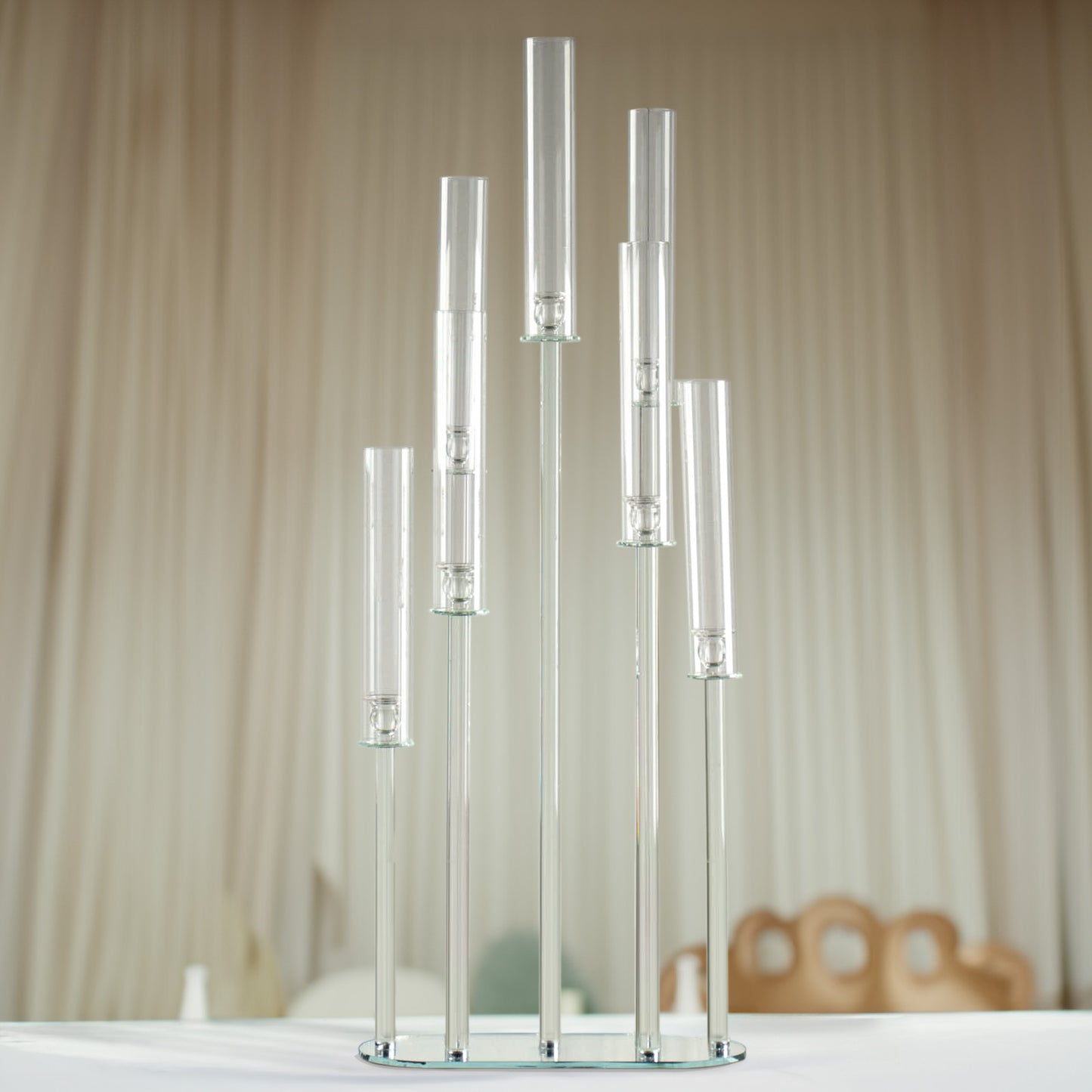 Clear crystal 7-arm cluster candlestick stand with hurricane shades.