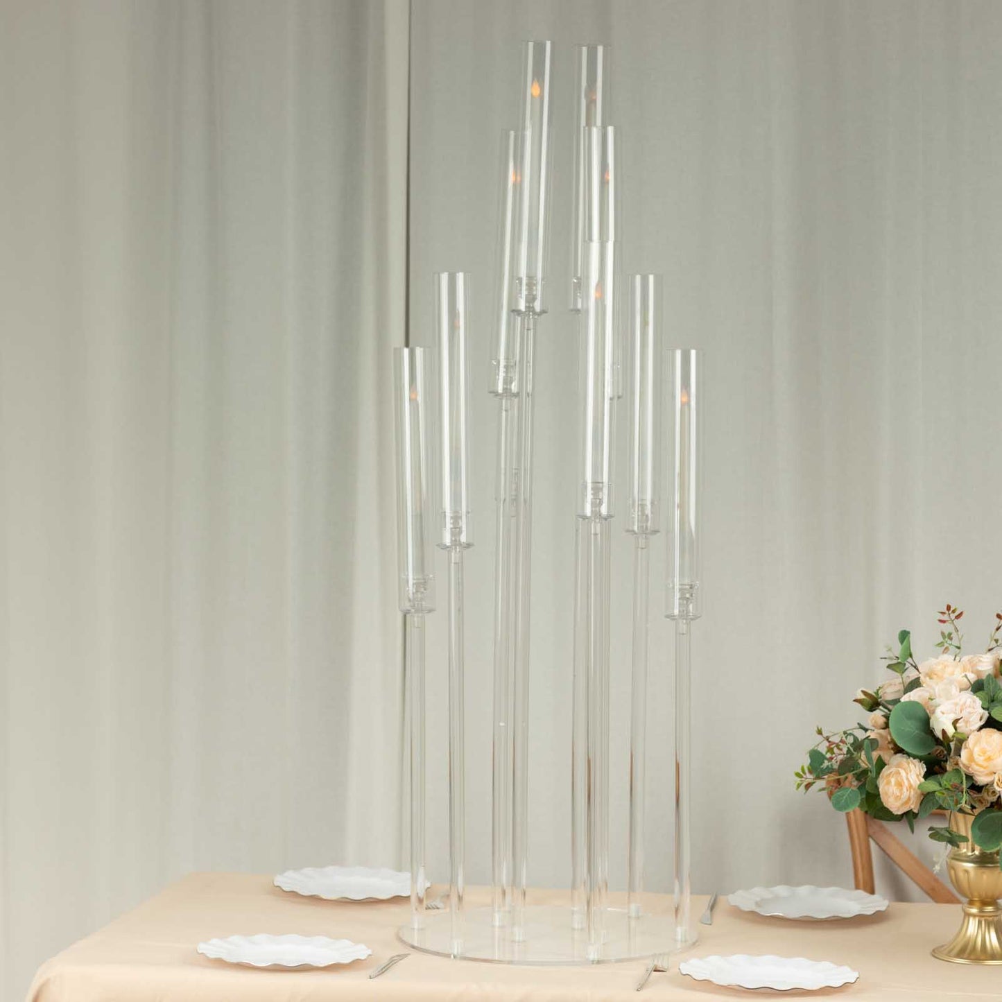Clear acrylic candelabra with 10 arms, 47" tall, ideal for elegant table settings.