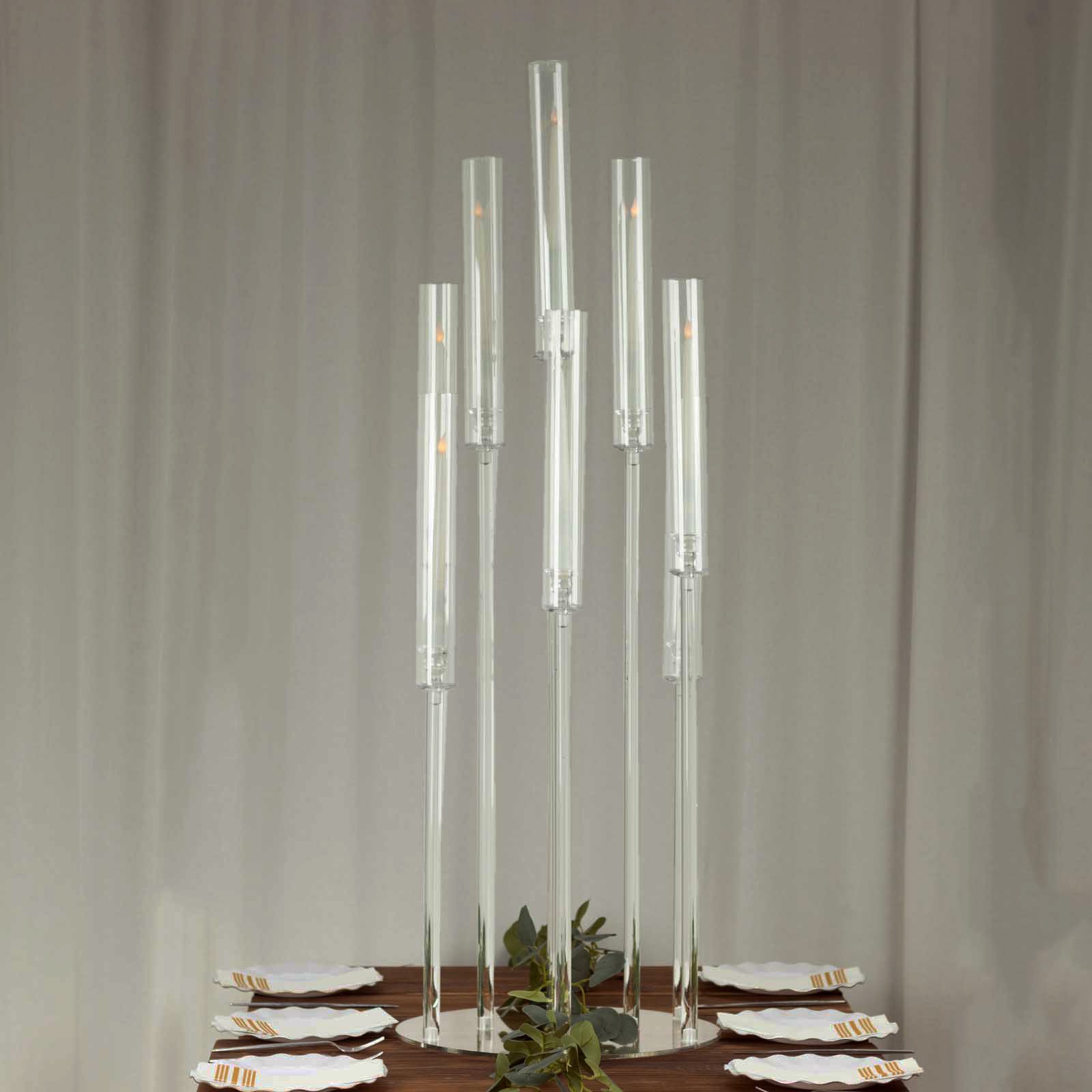 Clear acrylic candelabra candle holder, 47" tall with circular base.