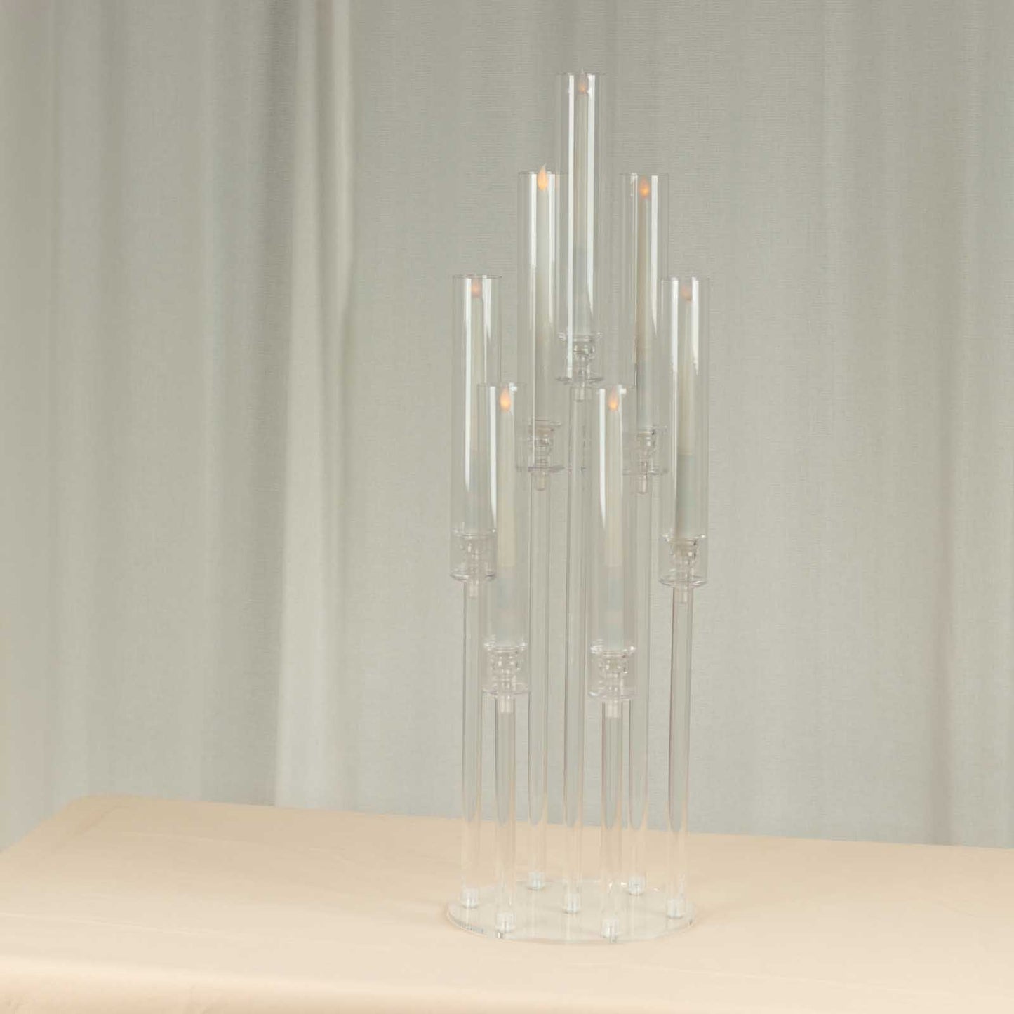 Clear acrylic 7 arm candelabra candle holder with circular base.