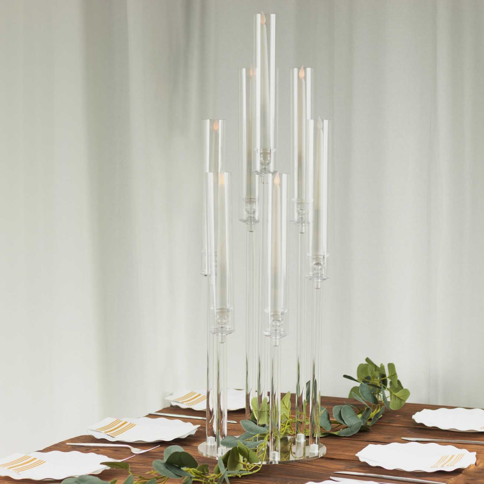 Clear acrylic 7-arm candle holder with a circular base, 33" tall.