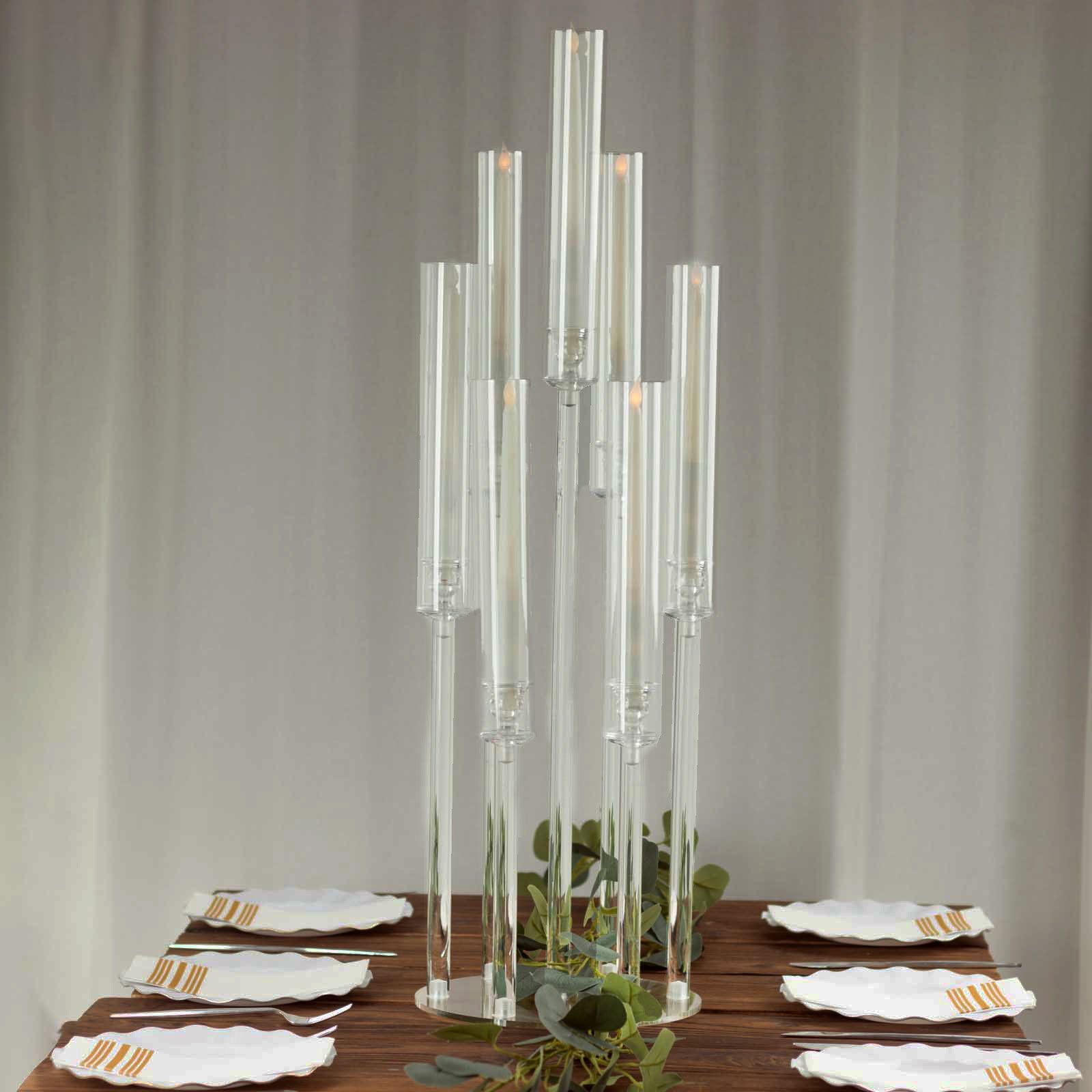 Clear acrylic 7-arm candelabra for taper candles, 33" tall with a circular base.