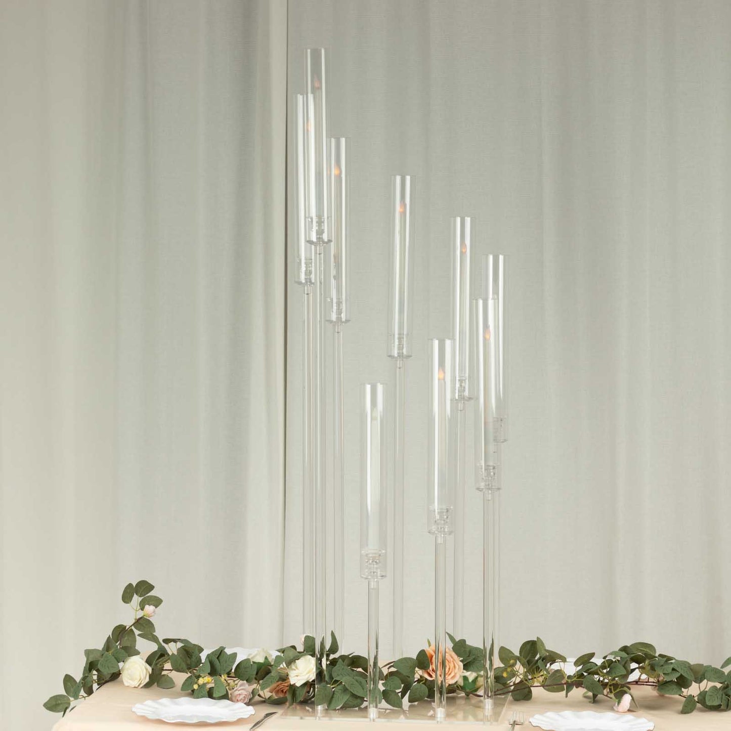 Clear acrylic 9-arm pillar candle holder with square base, 4ft tall.
