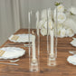 Clear glass candle shades with open ends, perfect for elegant table decor.