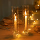 Clear glass candle shades with candles, creating a warm ambiance.