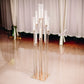 Gold 10 arm taper candle holder with clear glass shades.