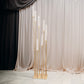 Gold 8 arm cluster taper candle holder with clear glass shades.