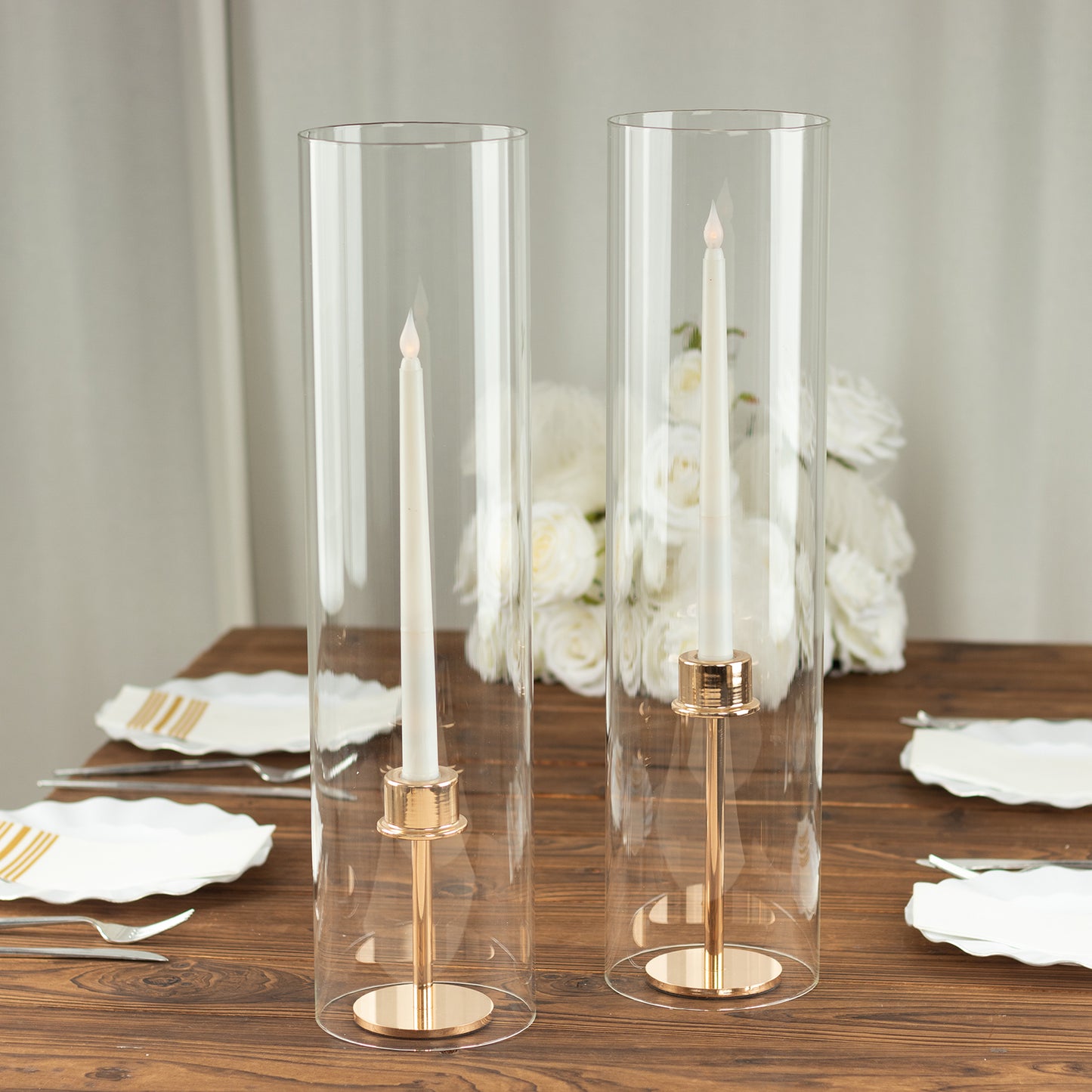 Clear candelabra candle holders with open ends and pillar shades.