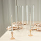 Clear candle holders with open ends for pillar candles.