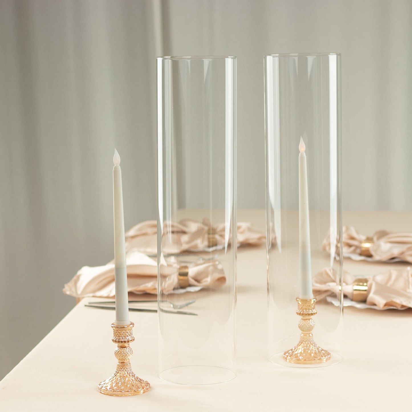 Clear candle holders with open ends for pillar candles.