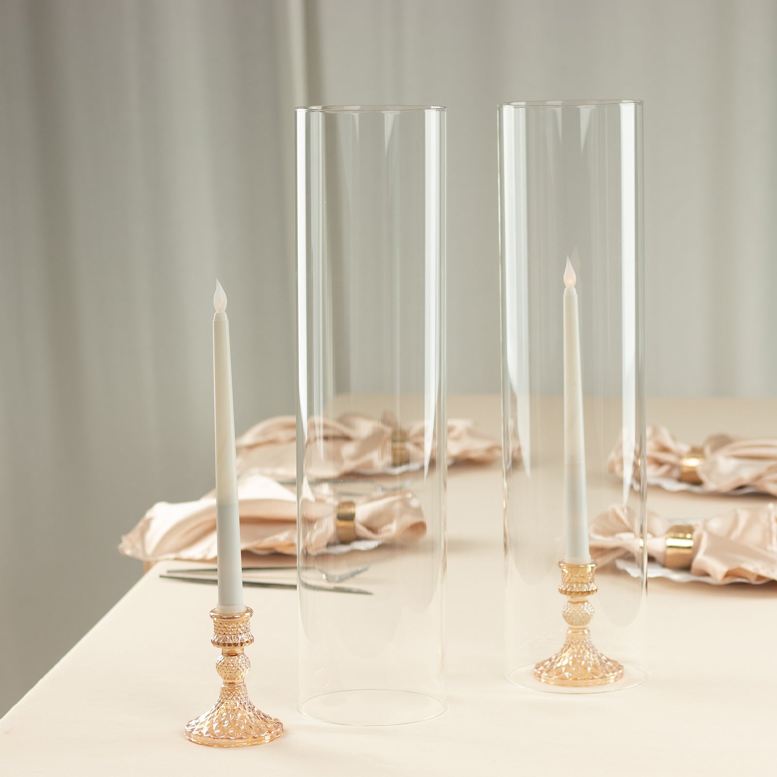 Clear candle holders with open ends for pillar candles.