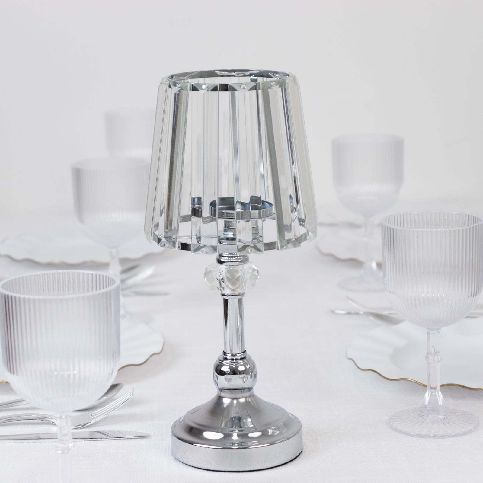 Silver crystal pendant candle holder for elegant table centerpieces.