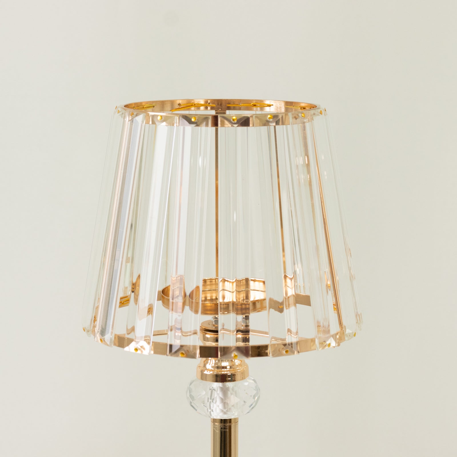 Gold crystal pendant candle holder with classic lamp shade design.