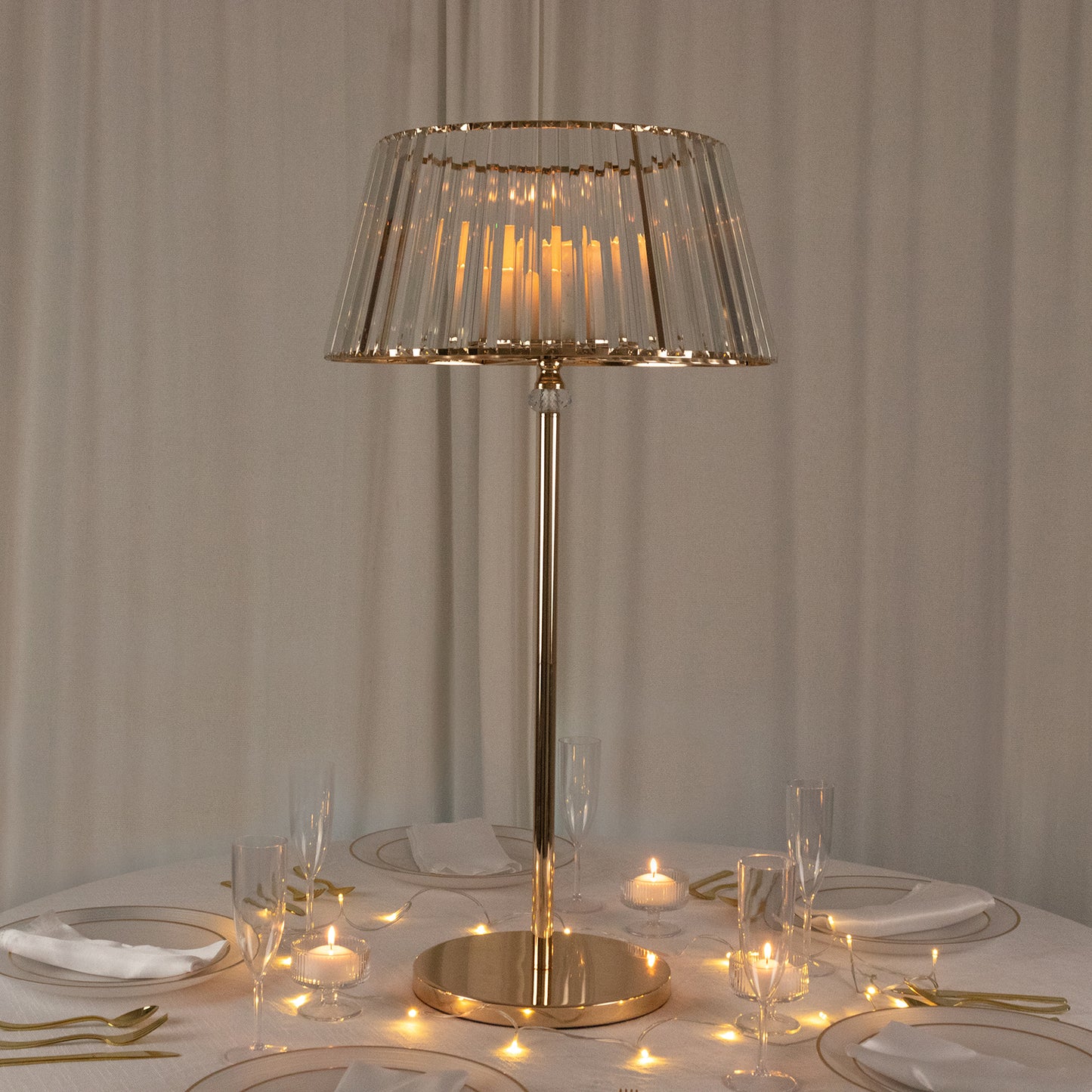 Gold crystal pendant candle holder with classic empire lamp shade style.