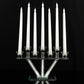 12" crystal glass candelabra with mirror base and seven white taper candles.