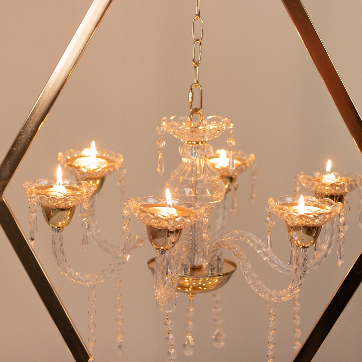 Gold 6-arm acrylic candelabra centerpiece with candle holders.
