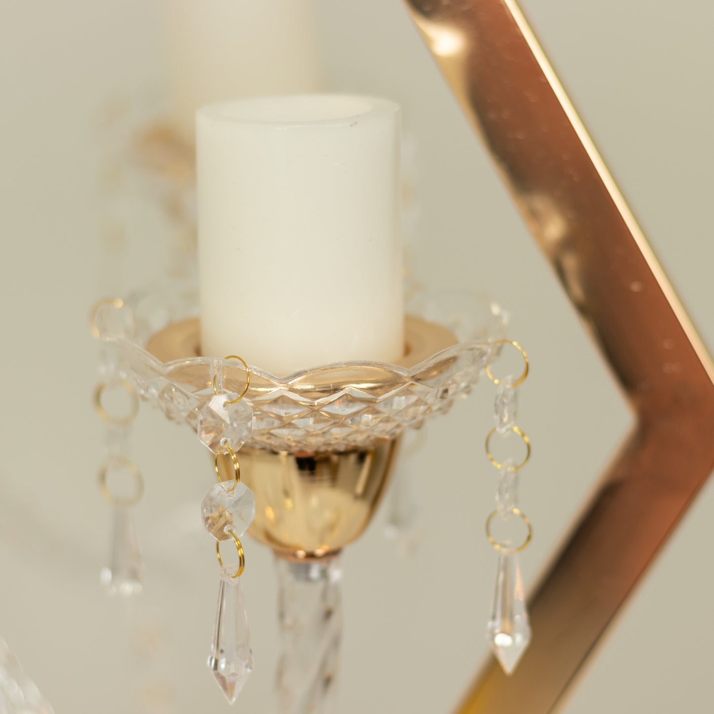 Gold 6-arm acrylic candelabra centerpiece with candle holders.