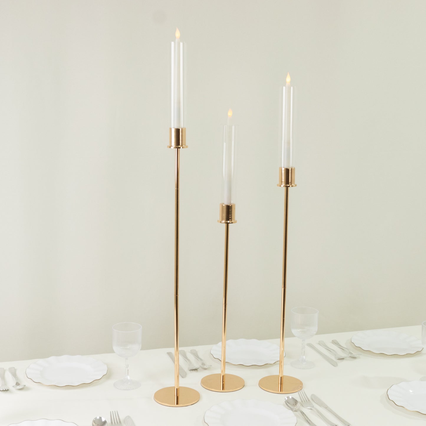 Gold taper candle holders with hurricane glass shades, set of 3.
