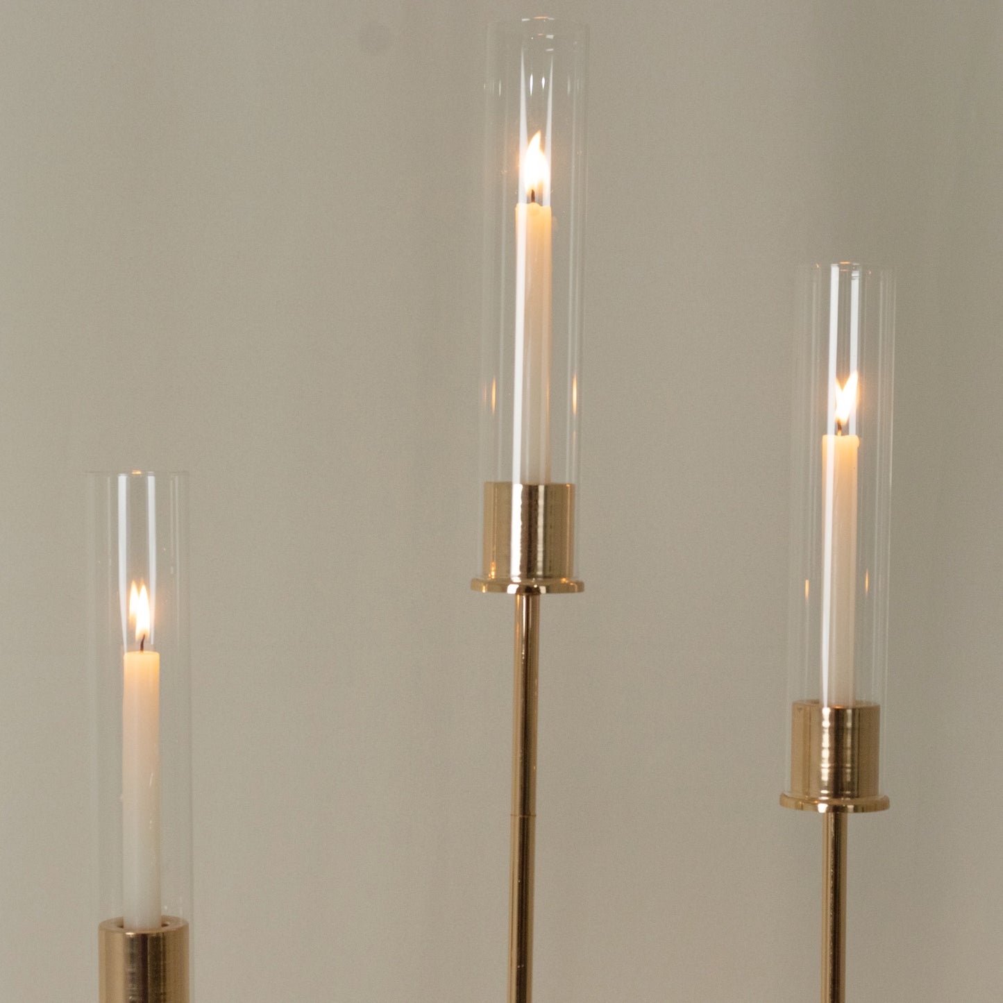 Gold metal taper candle holders with hurricane glass shades, set of 3.