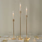 Gold metal taper candle holders with hurricane glass shades, set of 3.