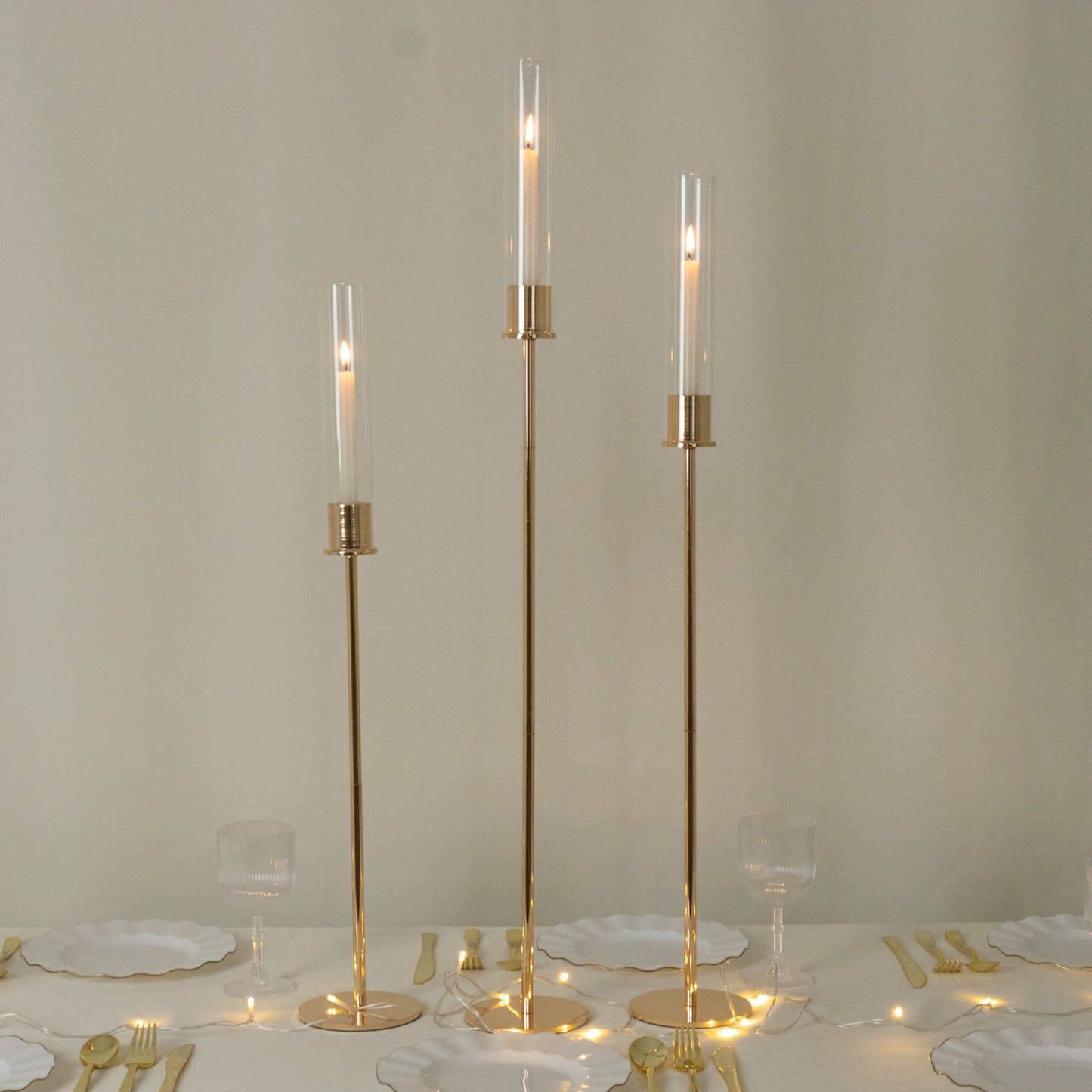 Gold metal taper candle holders with hurricane glass shades, set of 3.