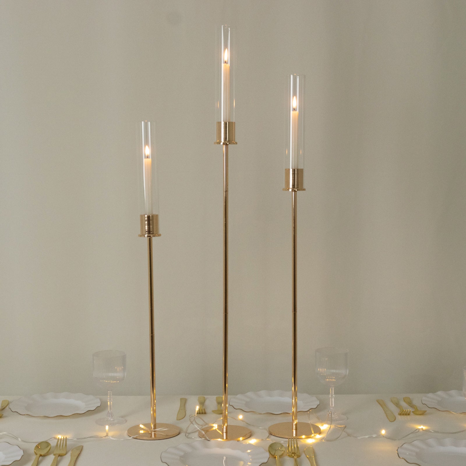 Gold metal taper candle holders with hurricane glass shades, set of 3.