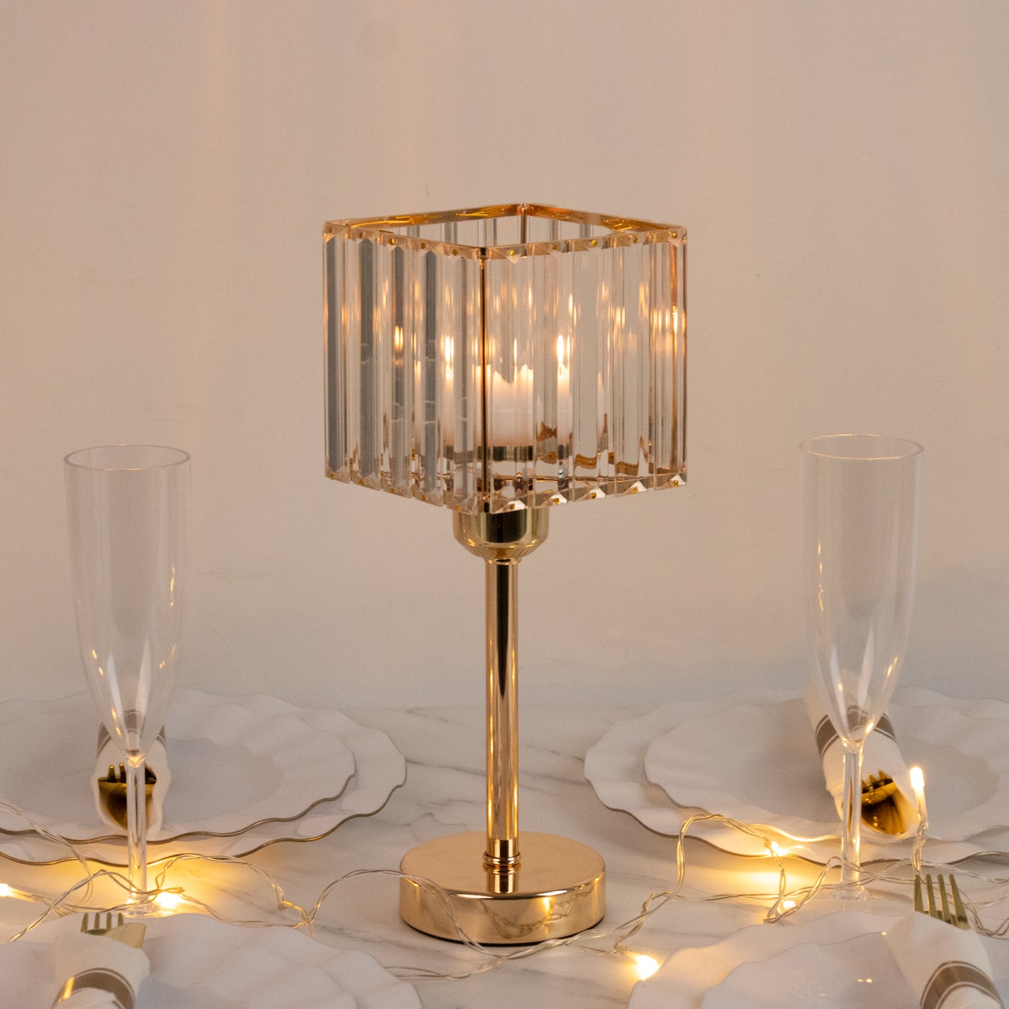 Gold crystal hurricane candle holder with elegant design.