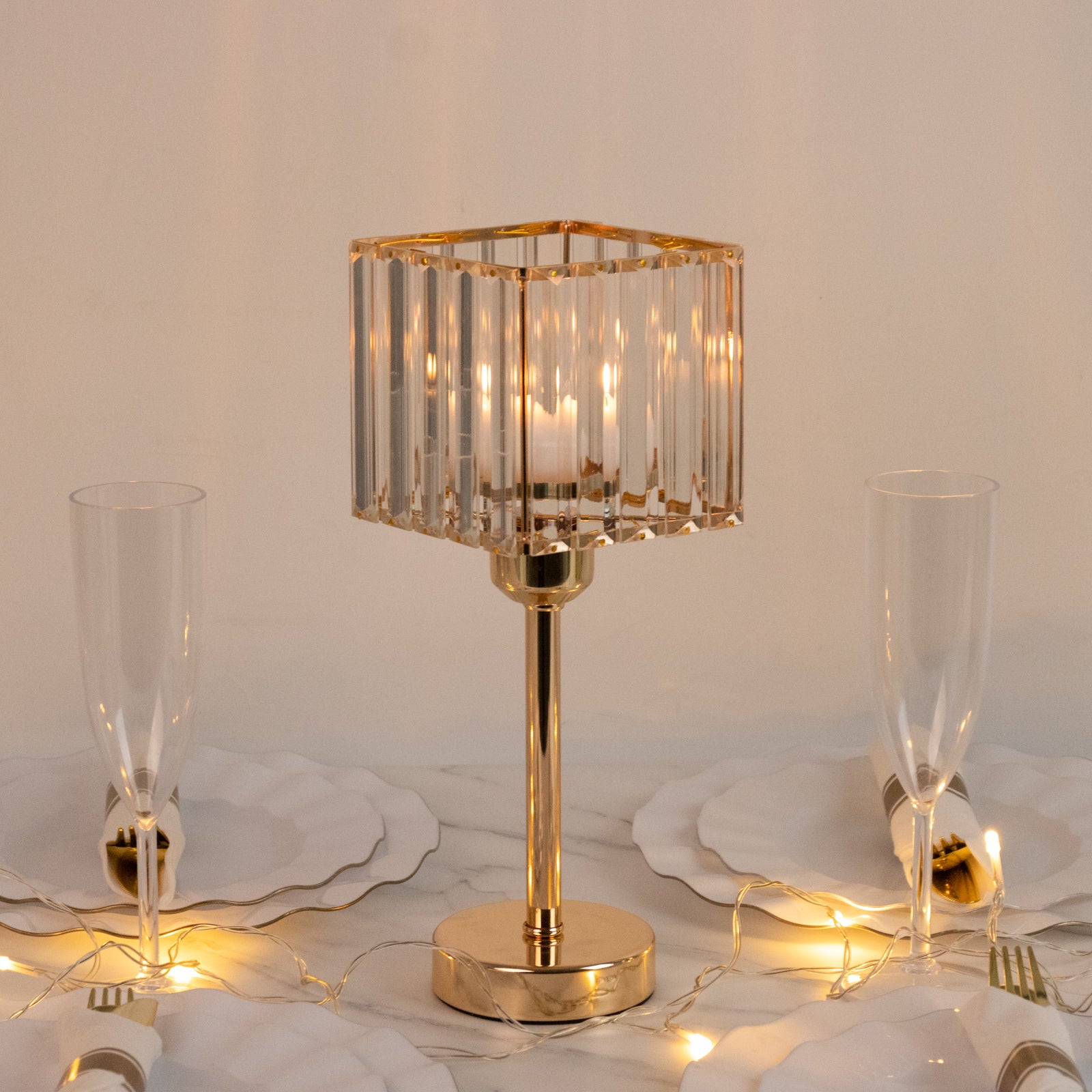 Gold crystal hurricane candle holder with elegant design.