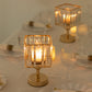 Gold crystal pendant candle holders for elegant table centerpieces.