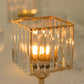 Gold crystal hurricane candle holder with elegant square design.