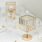 Gold crystal pendant hurricane candle holders for elegant table centerpieces.