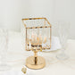 Gold crystal hurricane candle holder, elegant square design for decorative centerpieces.