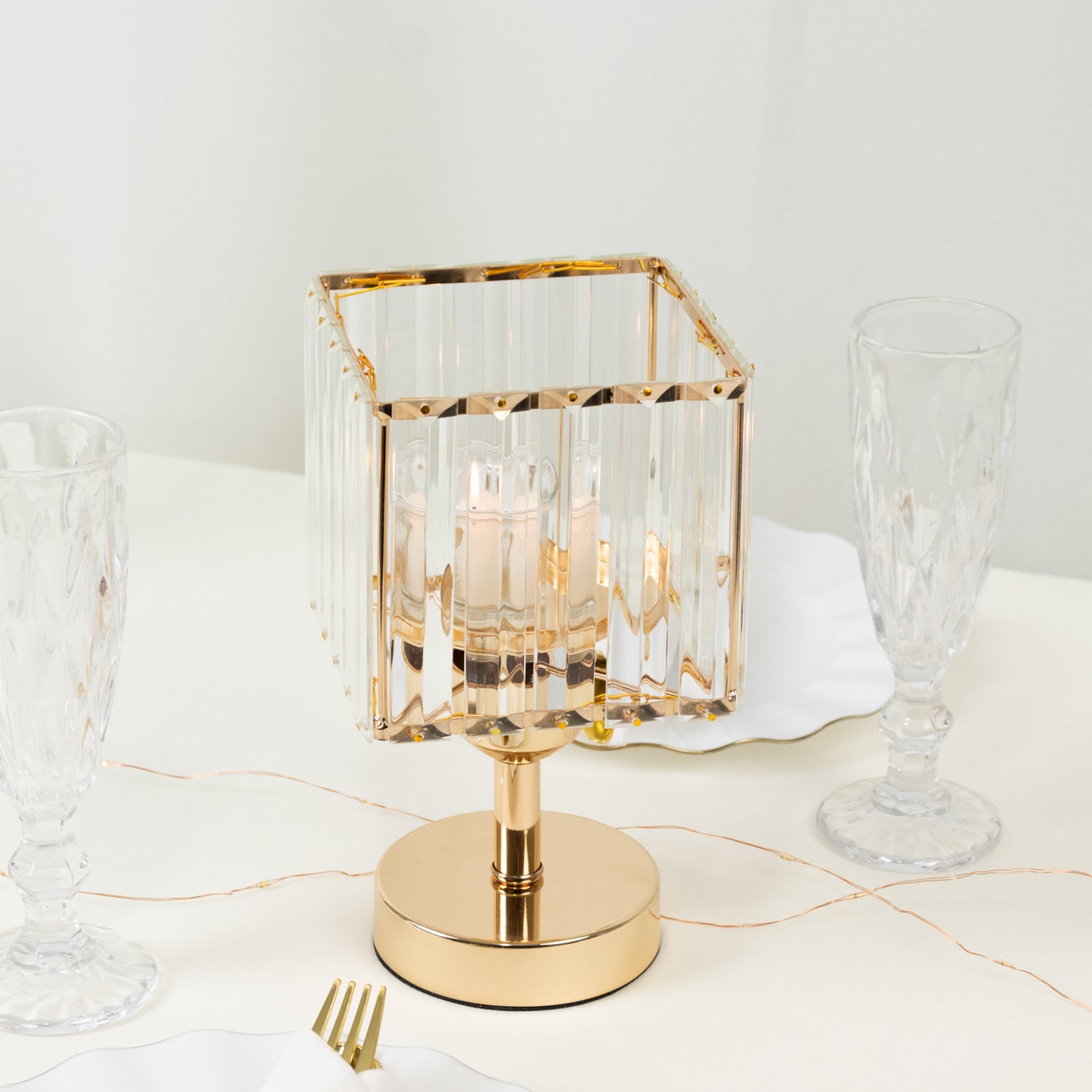 Gold crystal hurricane candle holder, elegant square design for decorative centerpieces.