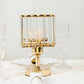 Gold crystal pendant hurricane candle holder on a decorative table setting.