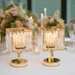 Gold crystal pendant hurricane candle holders as elegant table centerpieces.