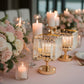 Gold crystal hurricane candle holders for elegant table centerpieces.