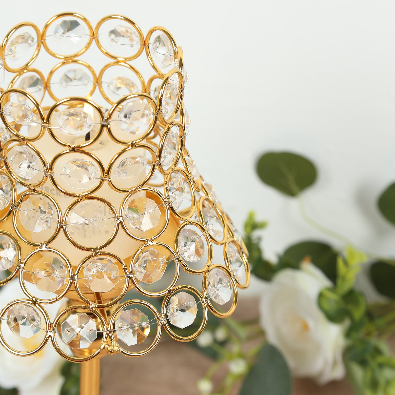 Gold crystal beaded candle holder with lamp-inspired shade.