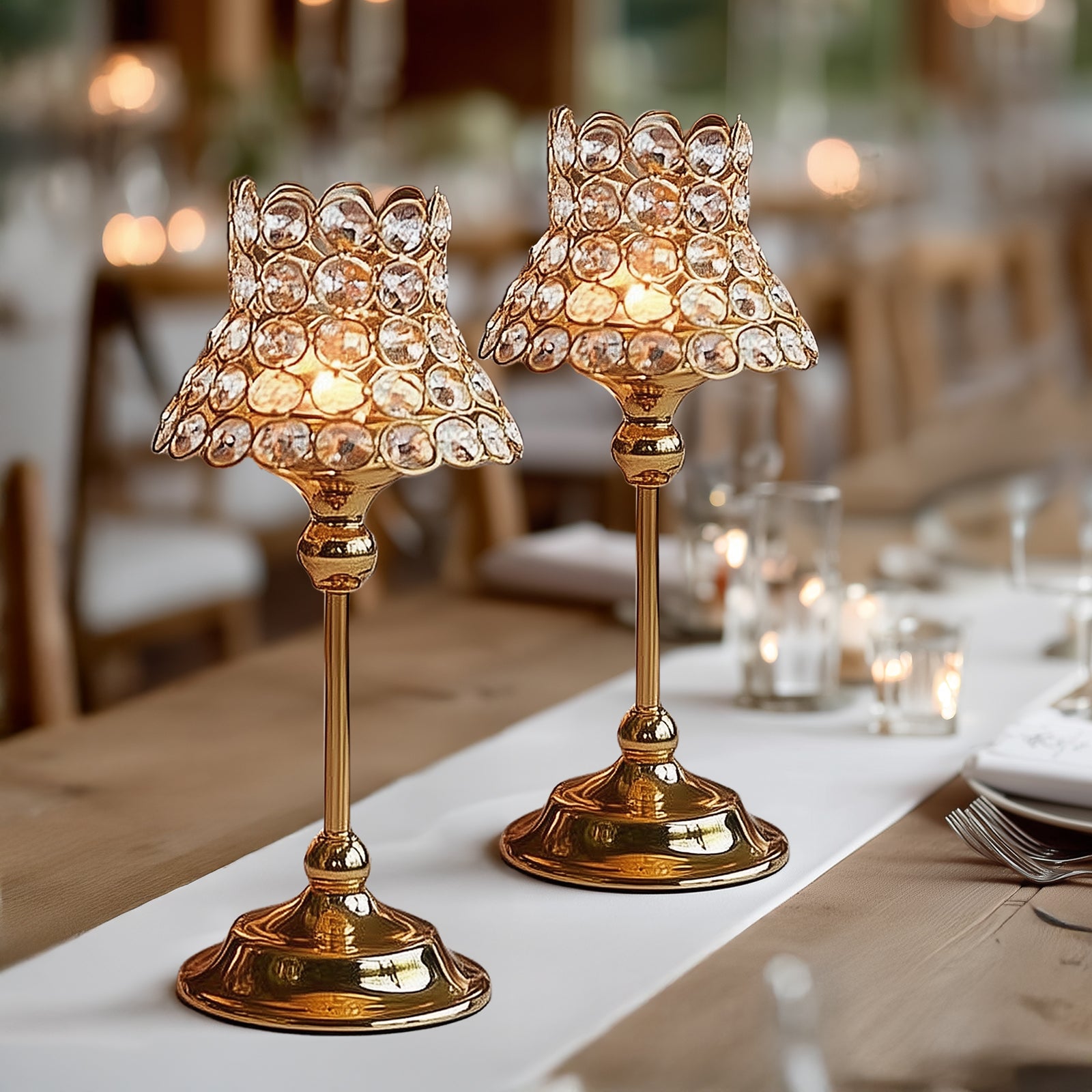 Gold crystal beaded candle holders with lamp-inspired shades for elegant tables.