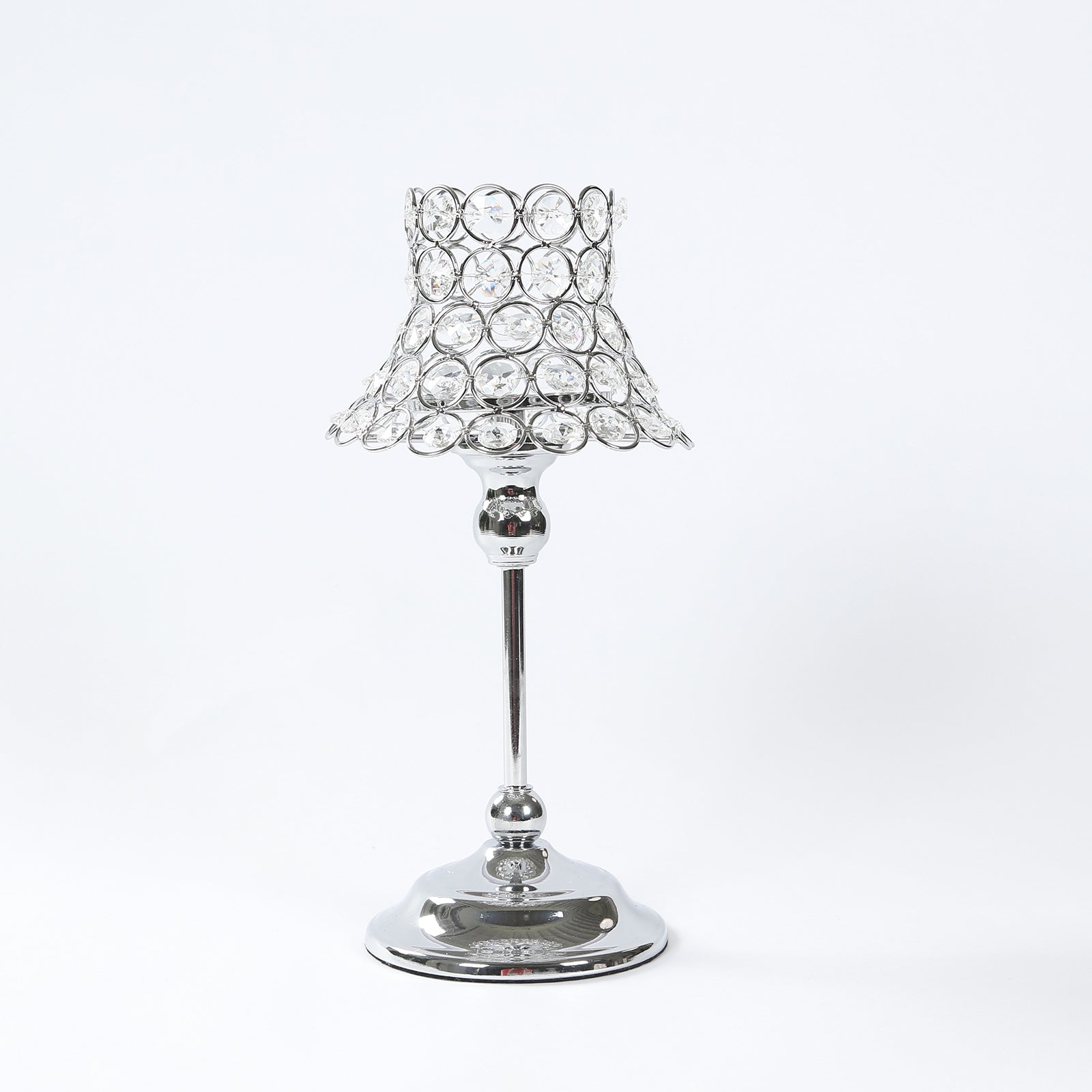 Silver crystal beaded candle holder with lamp-inspired shade.