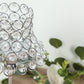 Silver crystal beaded candle holder with lamp-inspired shade.