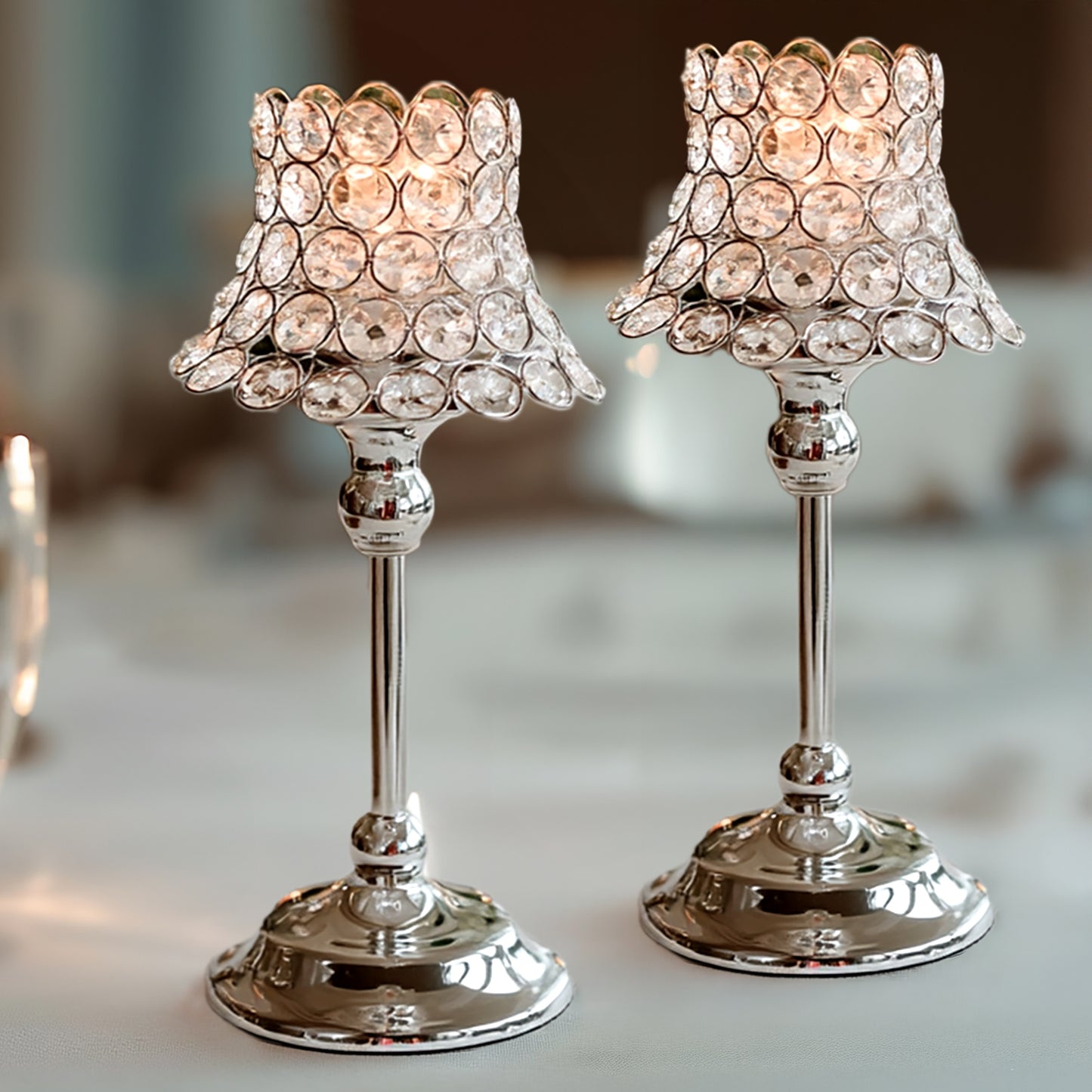 Silver crystal beaded candle holders with lamp-inspired shades.
