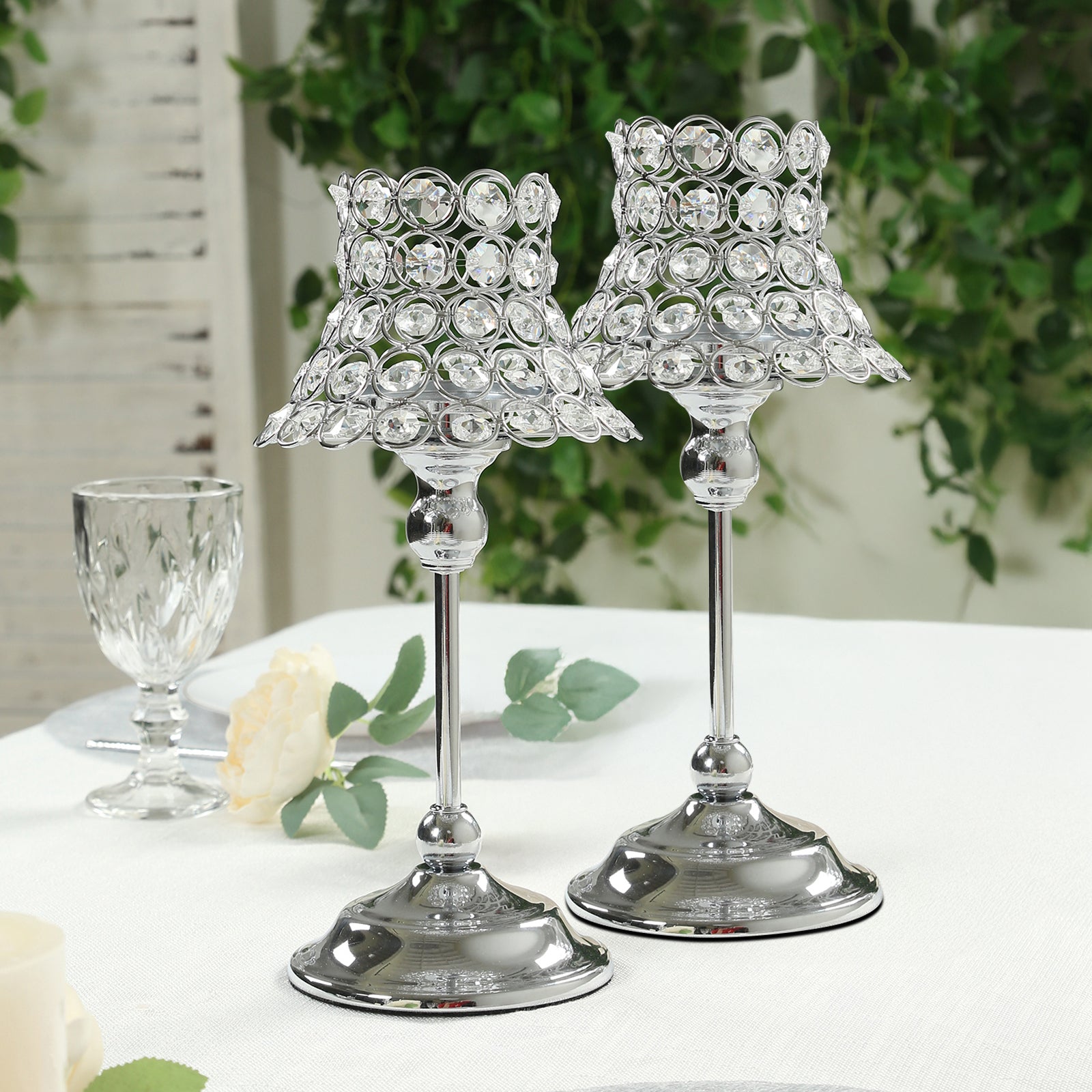 Silver crystal beaded candle holders with lamp-inspired shades.