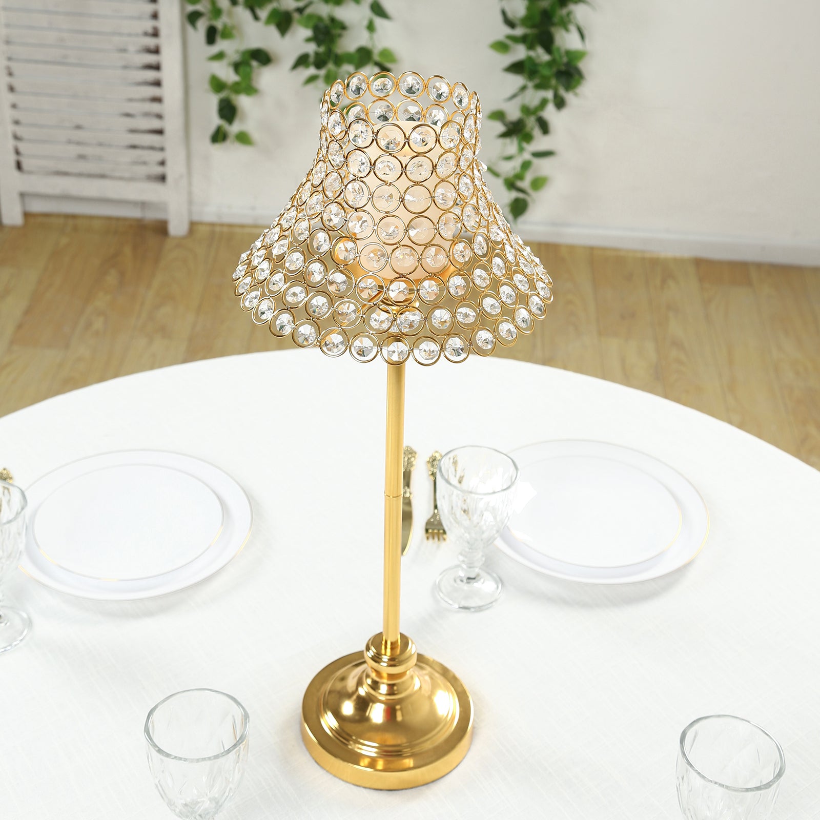 Gold crystal beaded candle stand with lamp-inspired shade for tables.